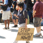 occupyaustin signs on Saturday (stop plutocracy now)