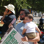 pictures of people at occupy austin (boy and dad)